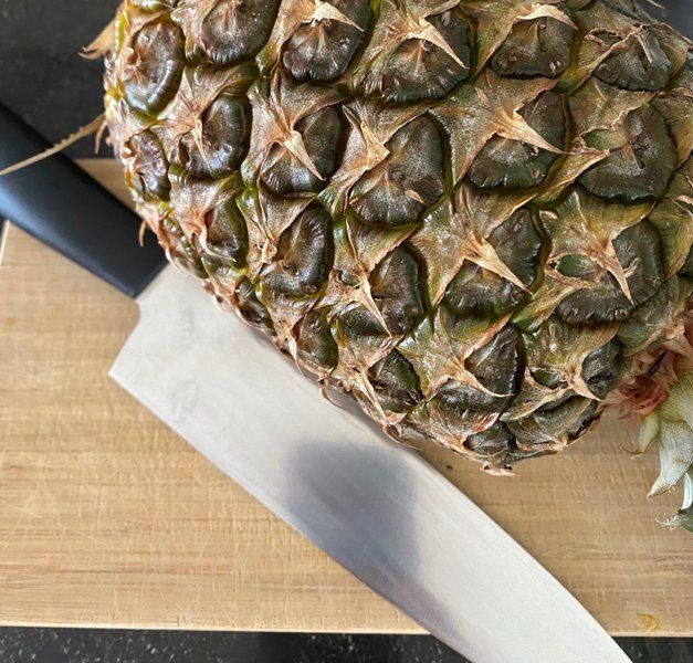 Pineapple with knife